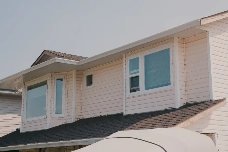 New white windows installed on BC home with vinyl siding